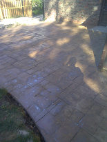 2 color stamped concrete patio w/ rounded edges