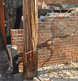 Rebuilt wing wall section in response to water breaching into underground garage